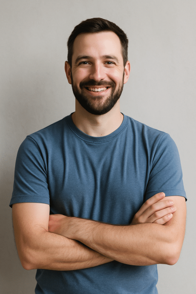 About Me 1 Portrait of Ramsay, founder of Tasty Mounjaro, smiling in a casual blue shirt
